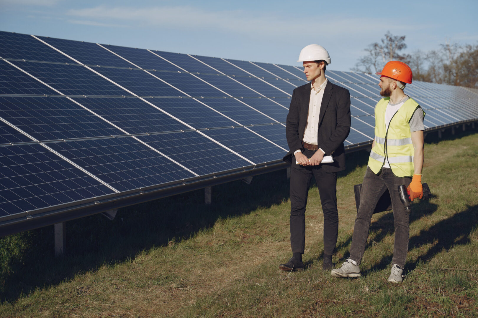Solar Panels and Their Energy Production 1 Foreman and businessman inspecting solar panel energy installation at a solar station