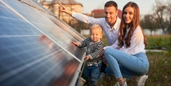 Family looking at solar pannels 585x295 1