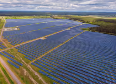 solar-panel-produces-green-environmentaly-friendly-energy-from-setting-sun-aerial-view-from-drone_661209-38