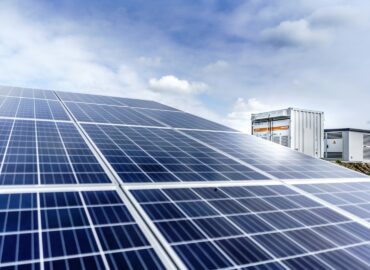 sungrow-emea-ceTSHQ0qars-unsplash Blue and white solar panels installed on a rooftop by a commercial solar company in Minnesota.